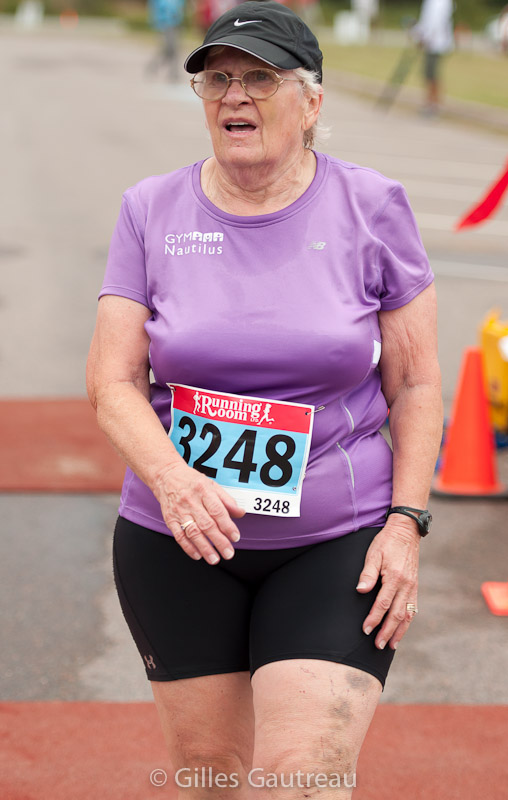 Gail Teed is shown at the finish line of the 2013 Hampton Five-Miler. Photo courtesy of Gilles Gautreau.