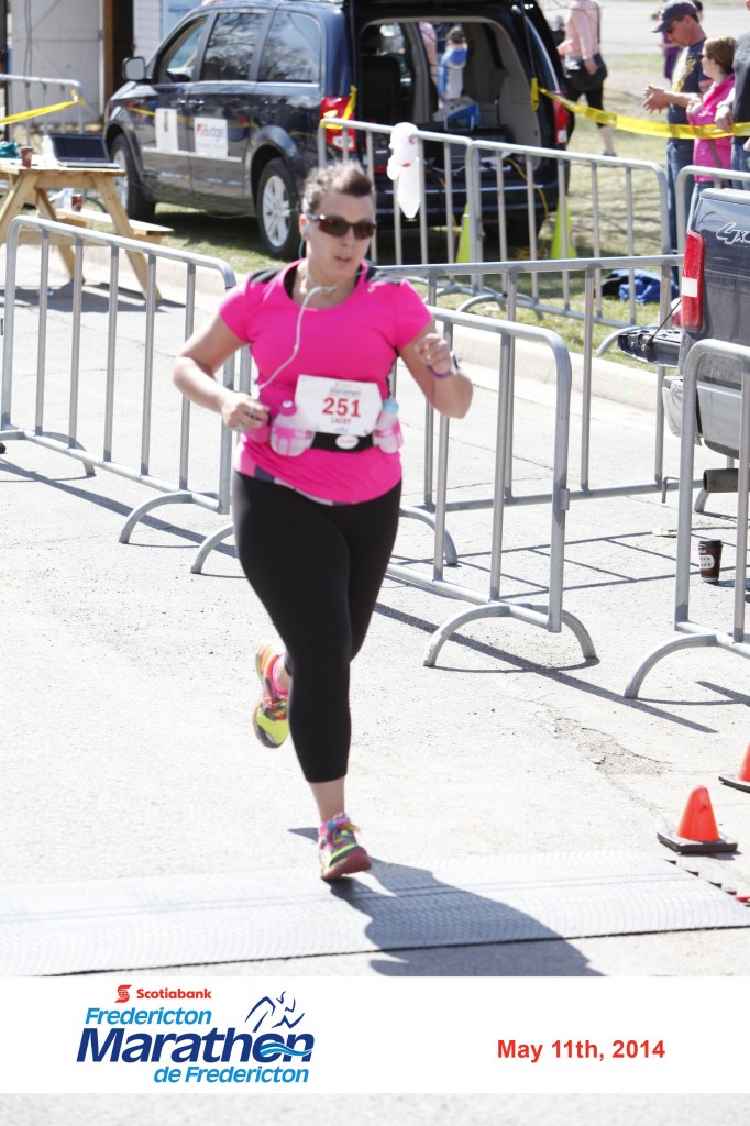 Lacey Clowater crosses the finish line at the Fredericton half marathon in May.
