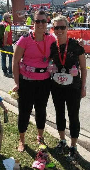 Lacey Clowater celebrates with her sister Heidi near the finish line at the Fredericton  half marathon in May.