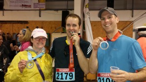 Kevin McEachern, right, poses with friends Janie Jones and Mark Whittaker after the  2014 YSJ Airport Run.