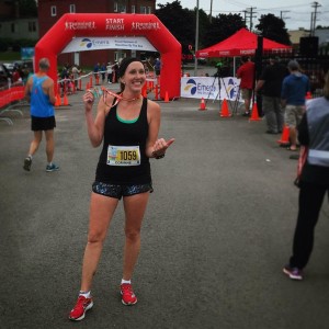 Corinne Fournier celebrates after completing the full marathon Sunday.