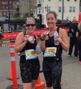 Jennifer Payne, left, and Vanessa Galbraith, celebrate after completing the half  marathon Sunday.